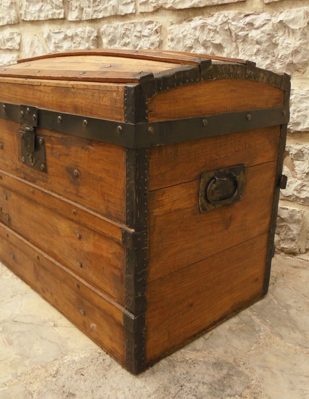 Ancient travel trunk, bulging wooden chest