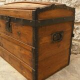 Ancient travel trunk, bulging wooden chest