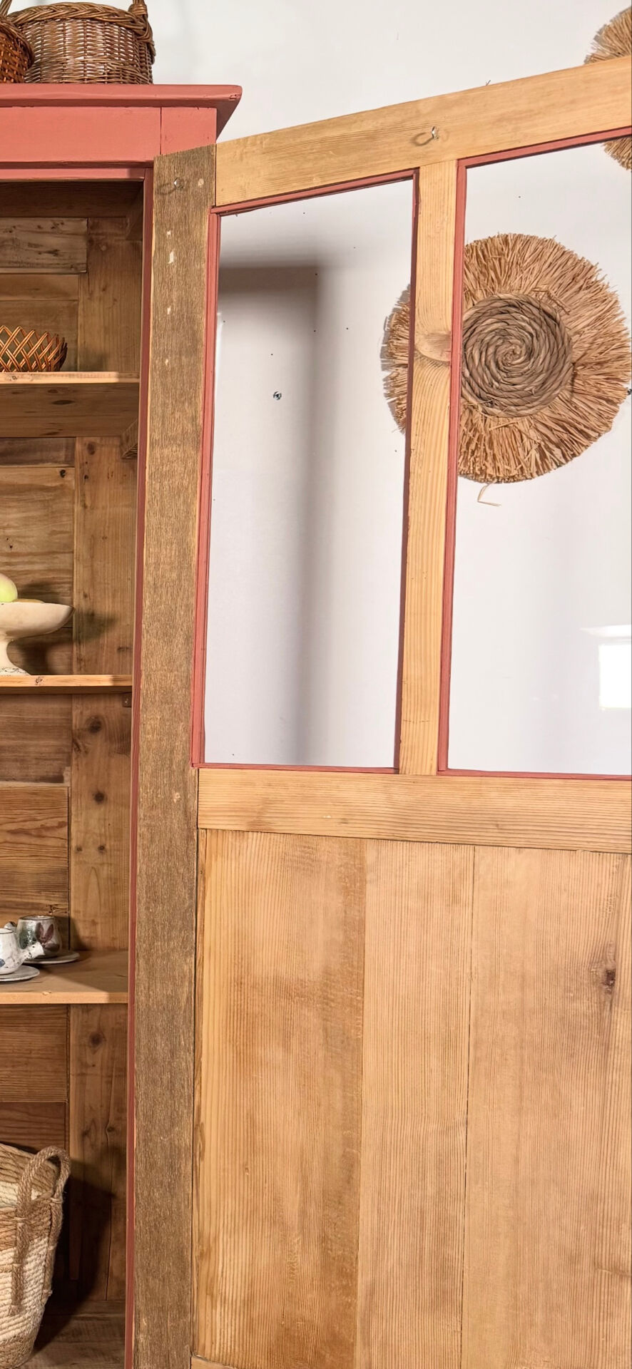 Antique glass-fronted terracotta cupboard