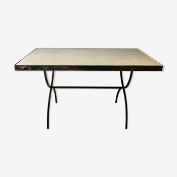 Table made of wrought iron and cement