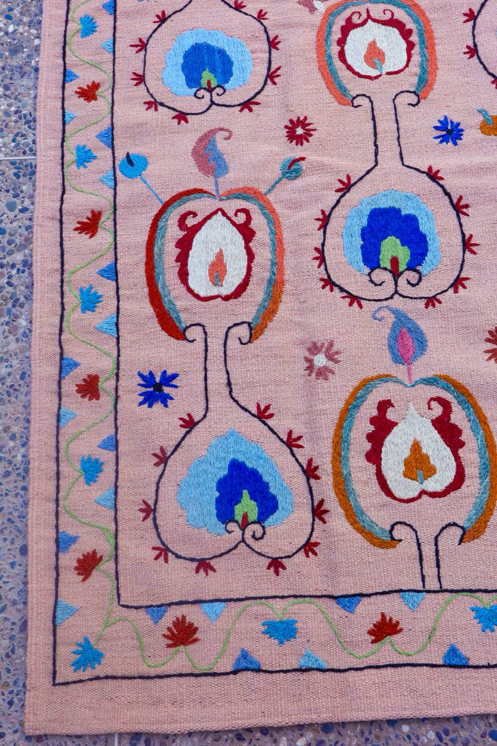 Salmon pink suzani kilim rug with embroidered patterns