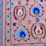 Salmon pink suzani kilim rug with embroidered patterns