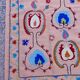 Salmon pink suzani kilim rug with embroidered patterns