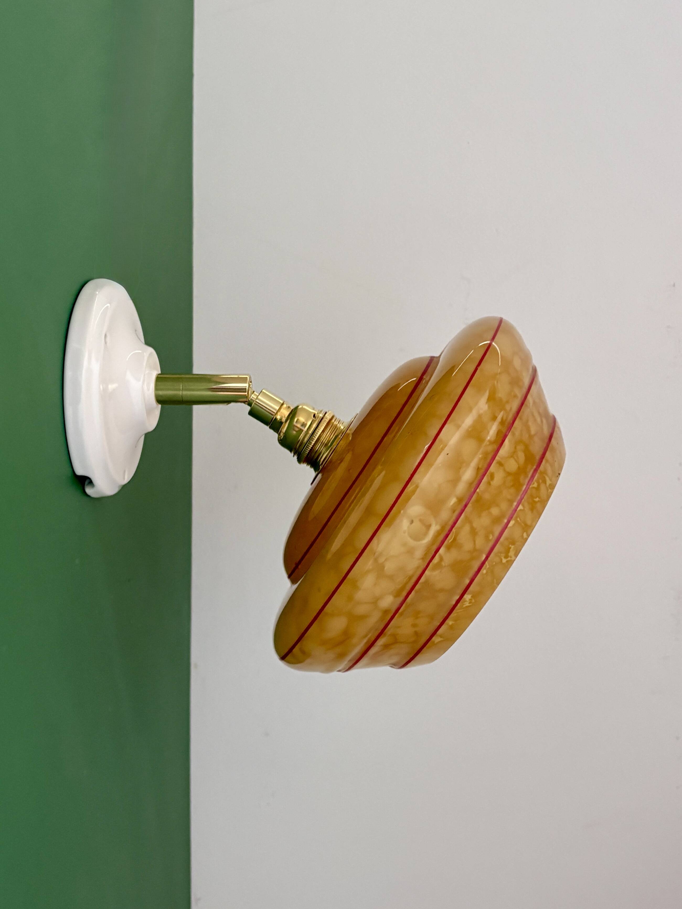 Vintage wall lamp with yellow clichy glass shade and red trim