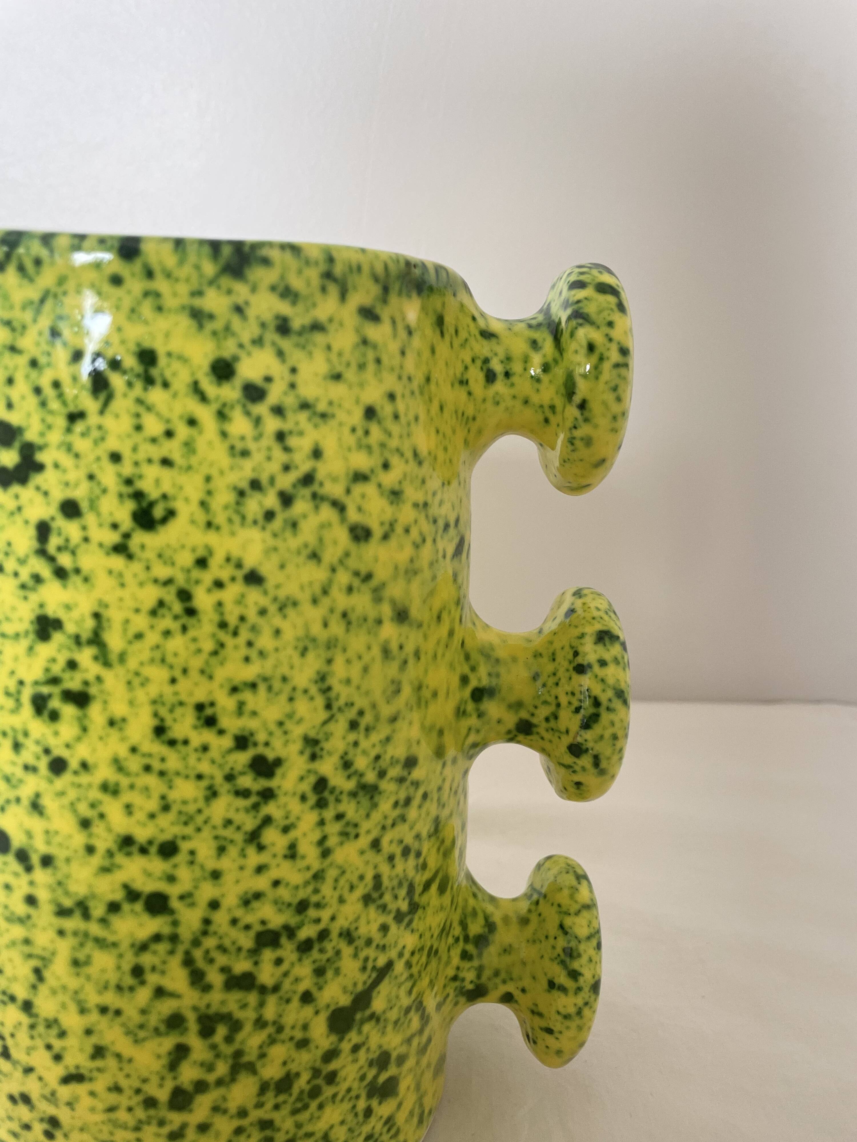 Handmade green speckled yellow ceramic vase with abstract handles