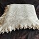 White cotton bedspread, crocheted sofa throw with star patterns