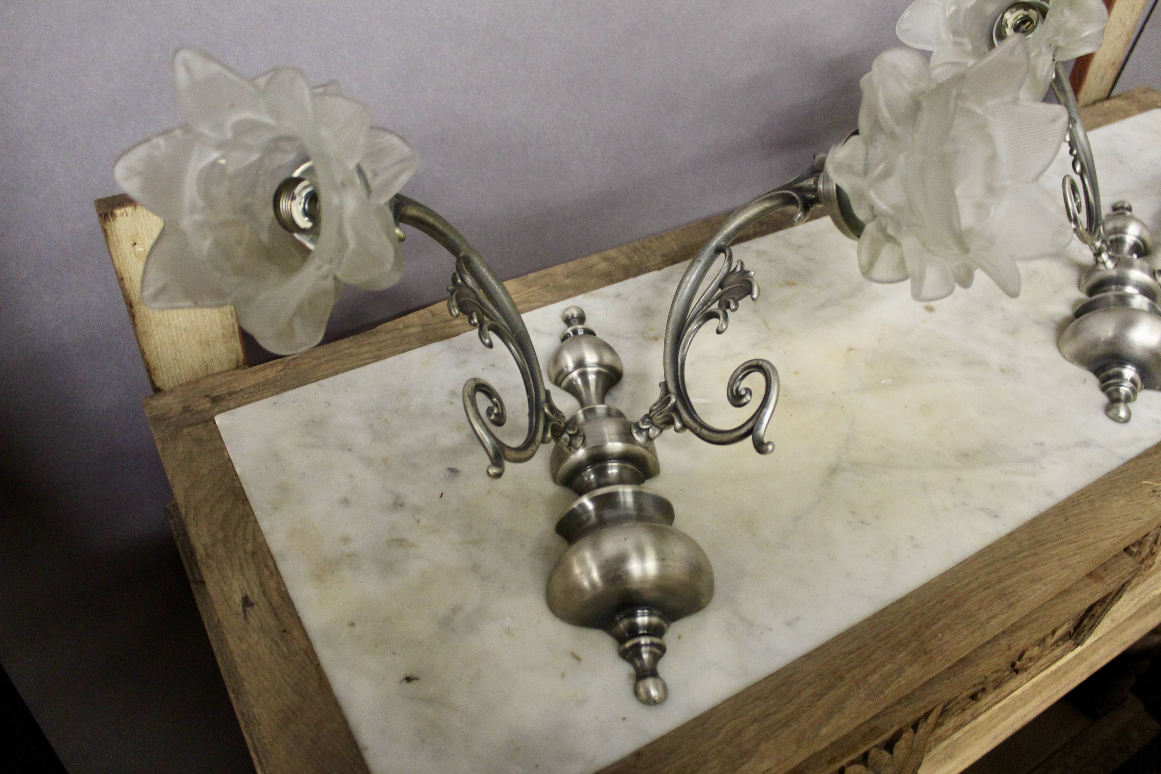 Pair of wall sconces with 2 light arms