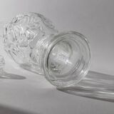 Vintage pressed glass carafe from the 1960s, clear sculptural glass with textured patterns and a stopper.