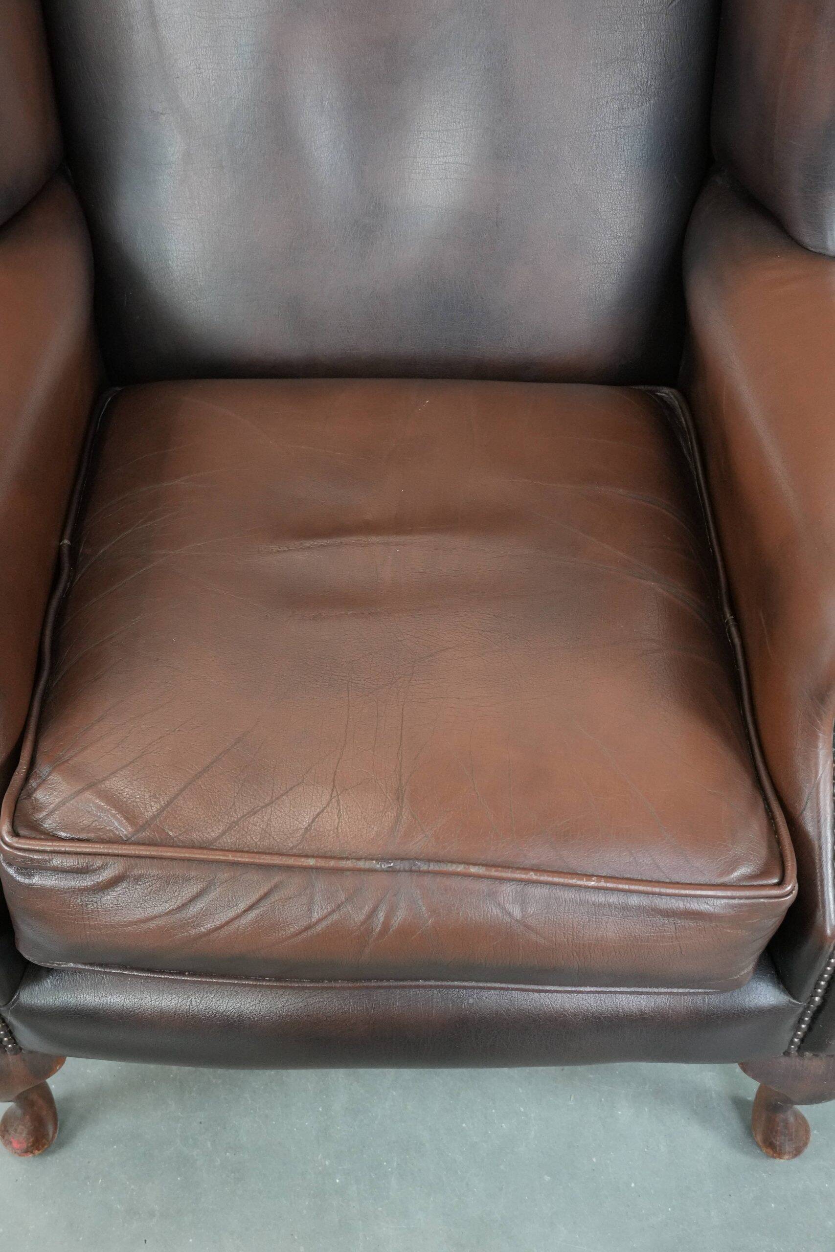 Brown smooth cow leather Chesterfield wingback armchair in English style