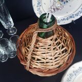 Small bottle style dame Jeanne and its wicker