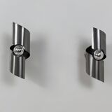 Pair of vintage wall lights, curved patinated steel, France, 1970.