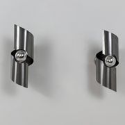 Pair of vintage wall lights, curved patinated steel, France, 1970.