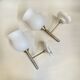 Pair of brass torch wall lights with white opal glass and porcelain