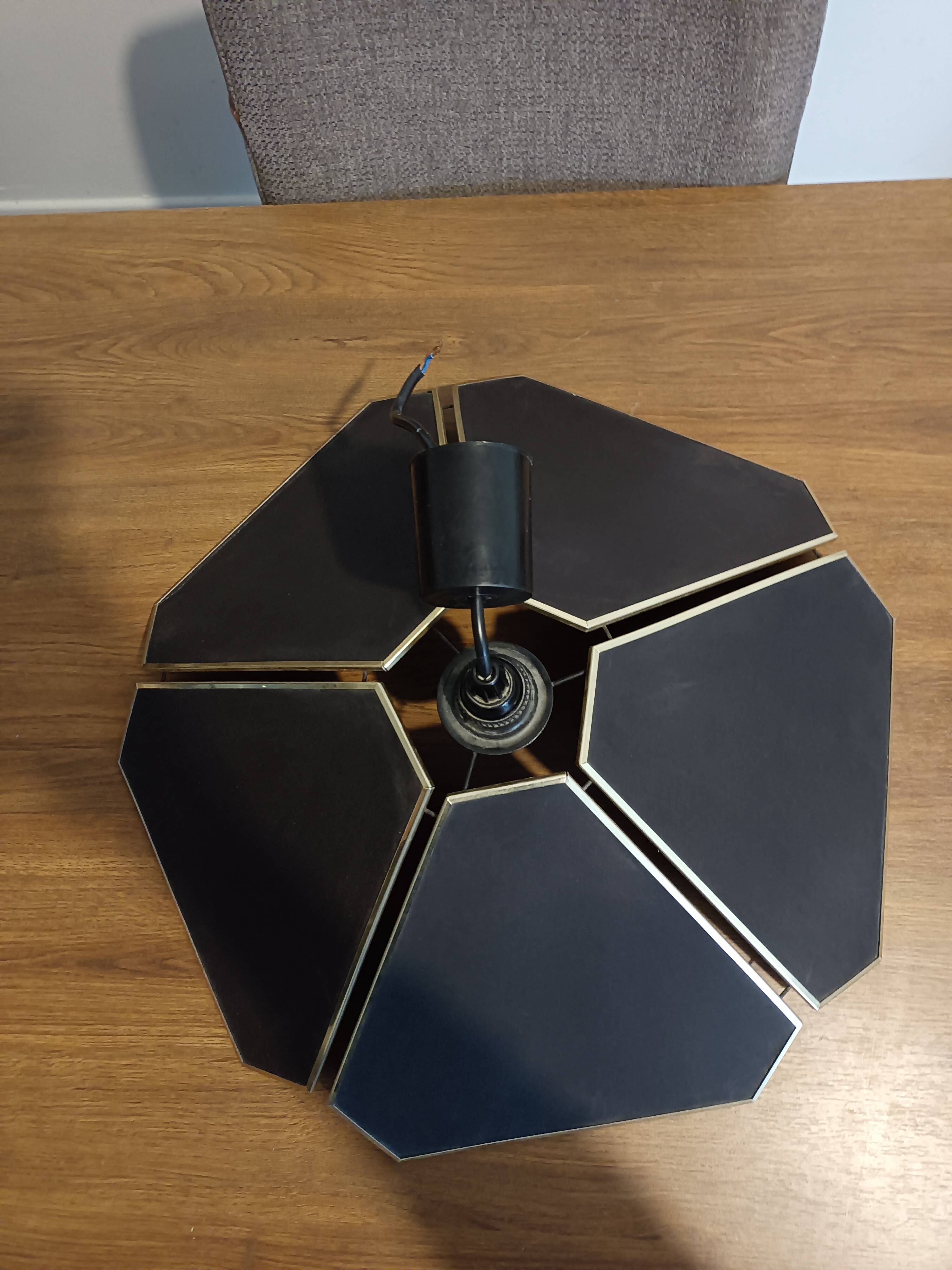 Black and gold petal suspension by Robert de Schuytener.