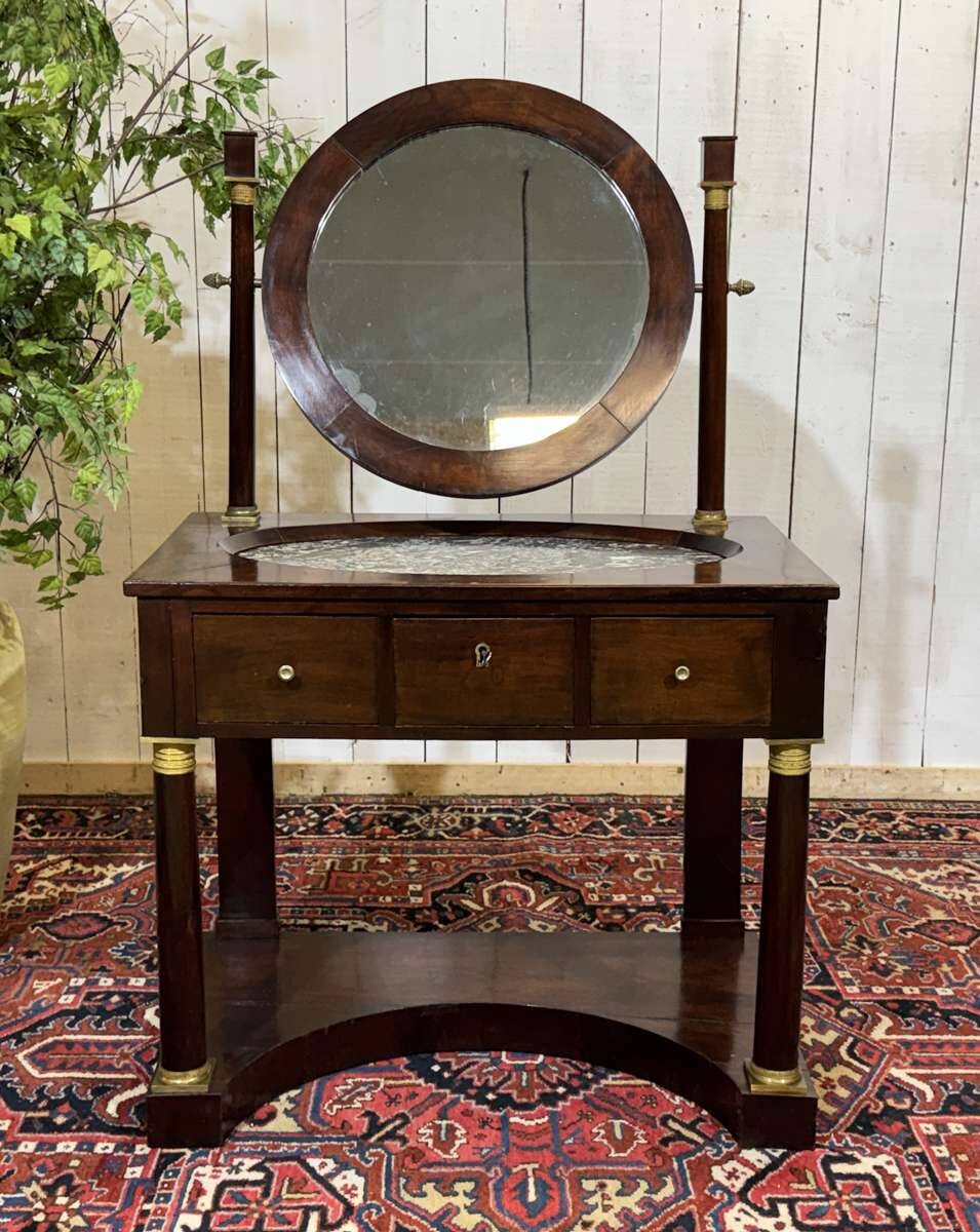Empire hairdresser from the 19th century in mahogany with a marble top.