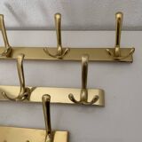 Three vintage 1960s gold coat racks 4, 3 and 2 hooks