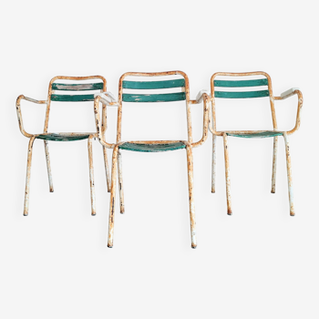 Old white and green wood and metal chairs