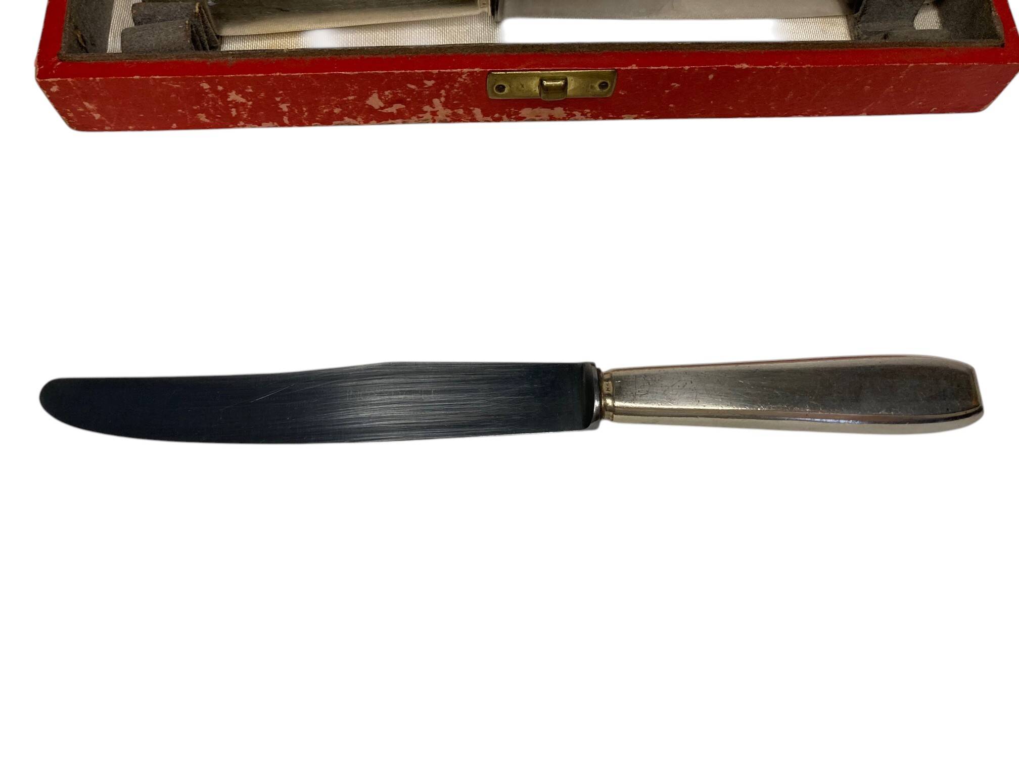 Tableware, 12 dessert knives made of silver-plated metal around 1950.