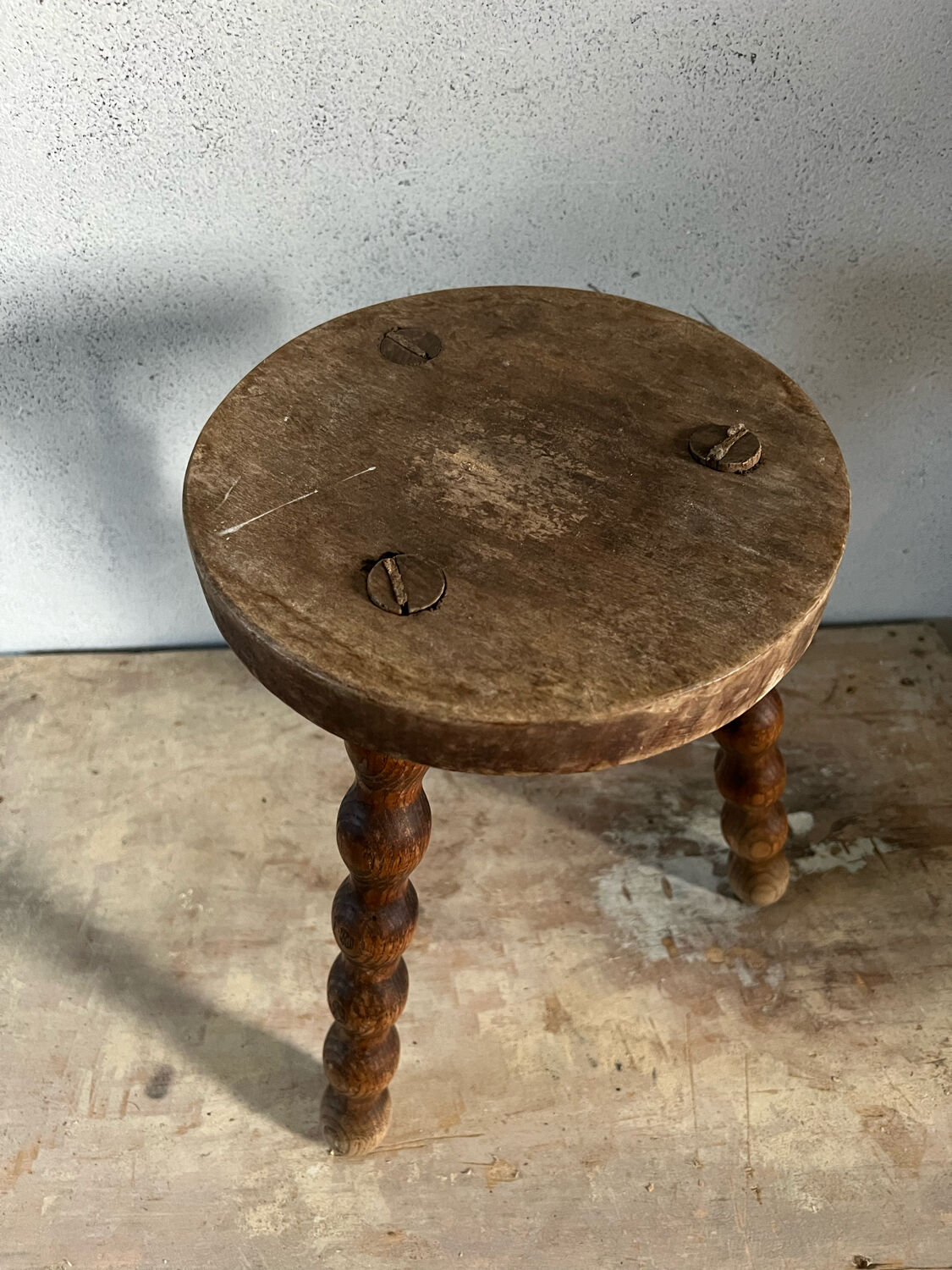 Wooden tripod stool