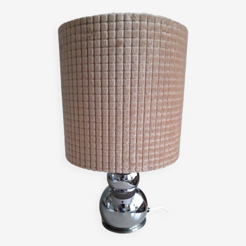 Vintage lamp with a curved metal base and its velvet lampshade