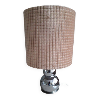 Vintage lamp with a curved metal base and its velvet lampshade