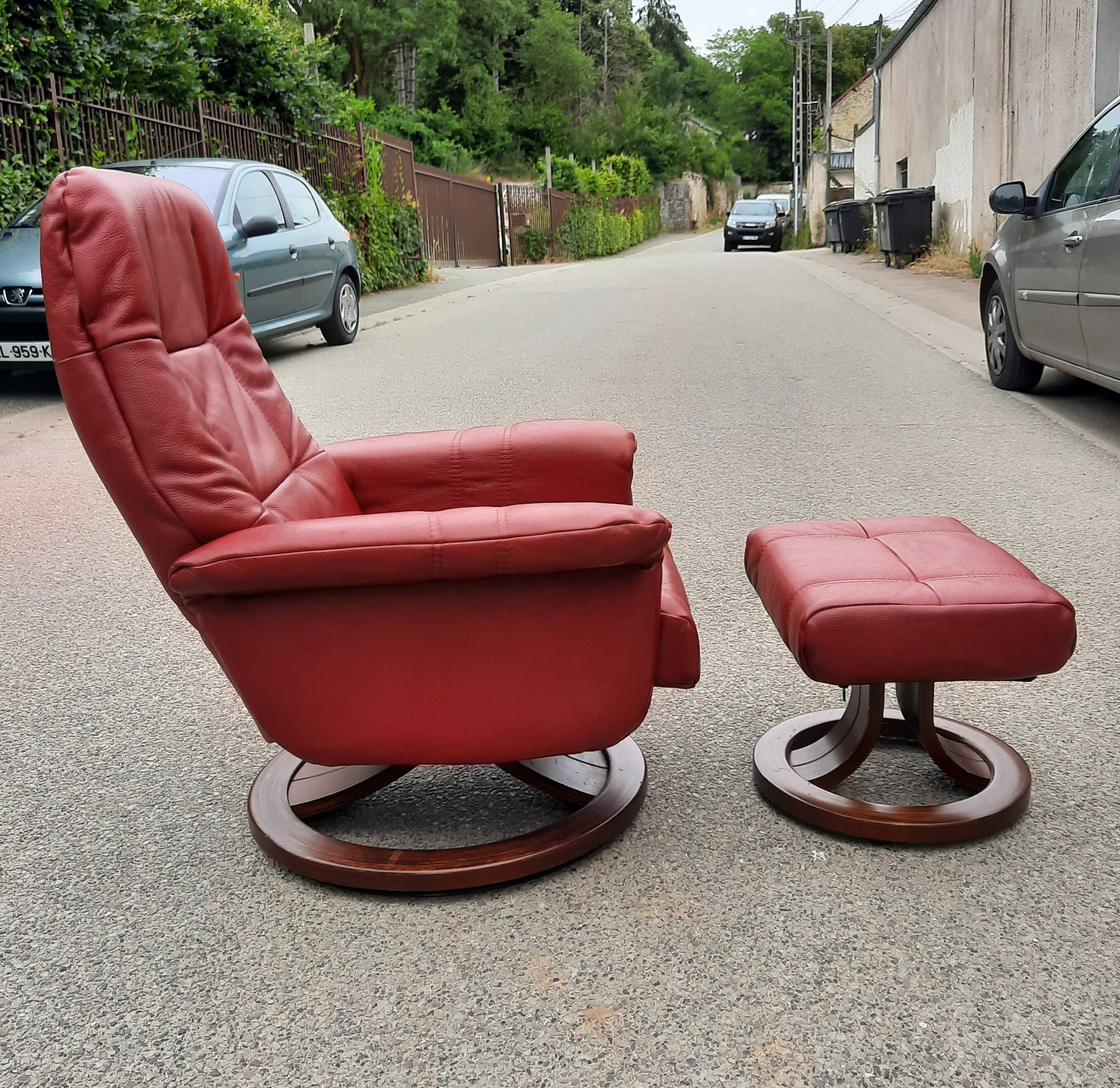 Red leather relax armchair and pouf