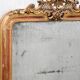 19th-century Louis-Philippe mirror with patina and pediment.