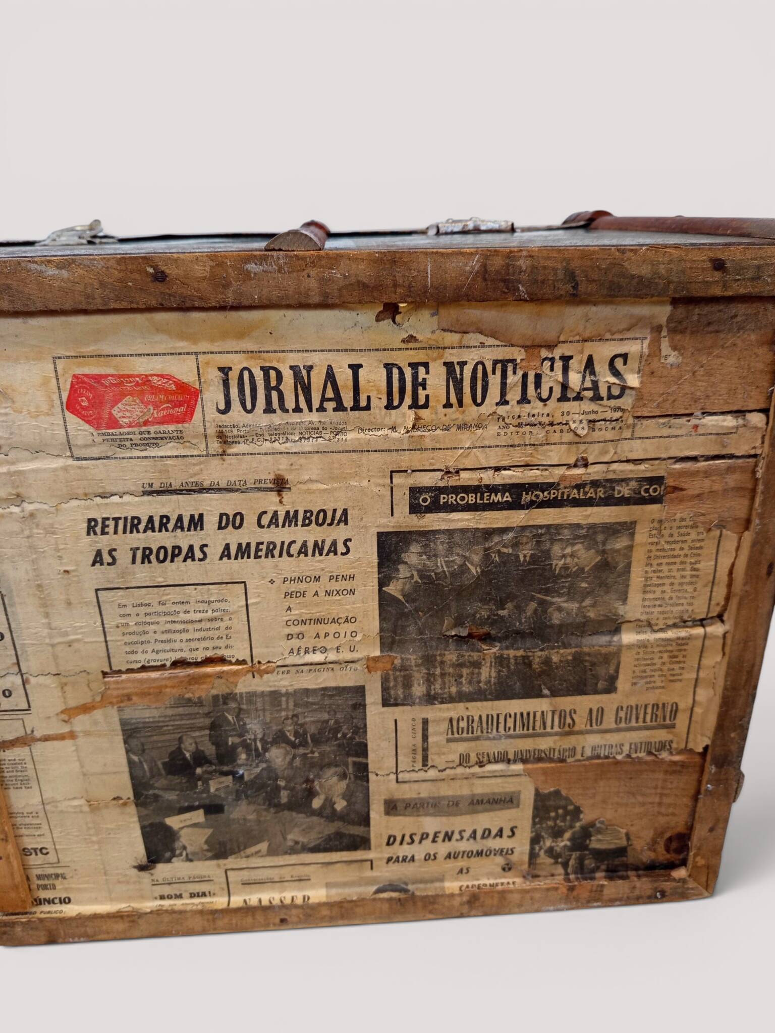 Vintage wooden and metal green travel trunk, circa 1930.