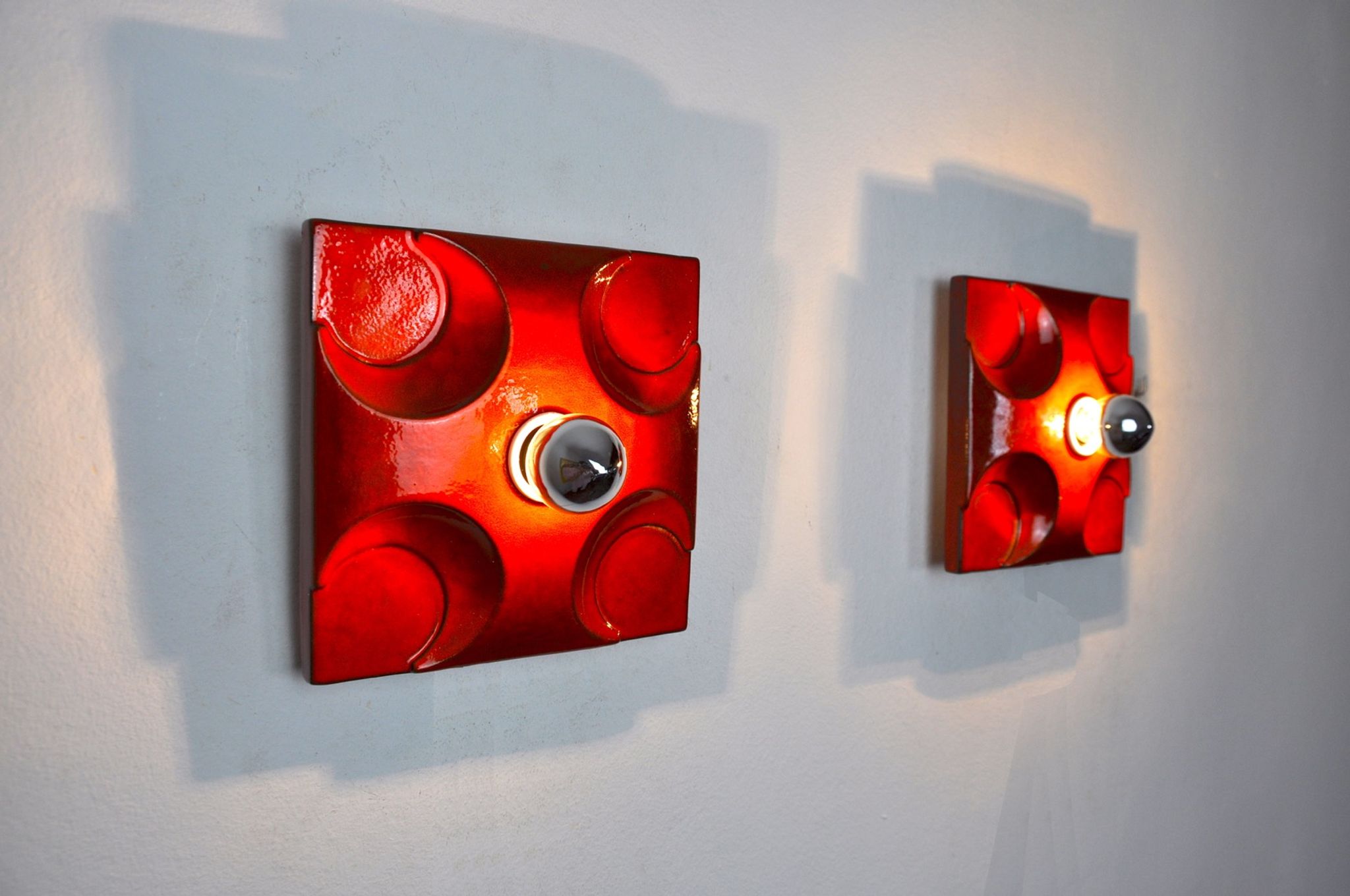 Pair of Fat Lava wall lamps by Hustadt Leuchten, Orange ceramic, Germany, 1960