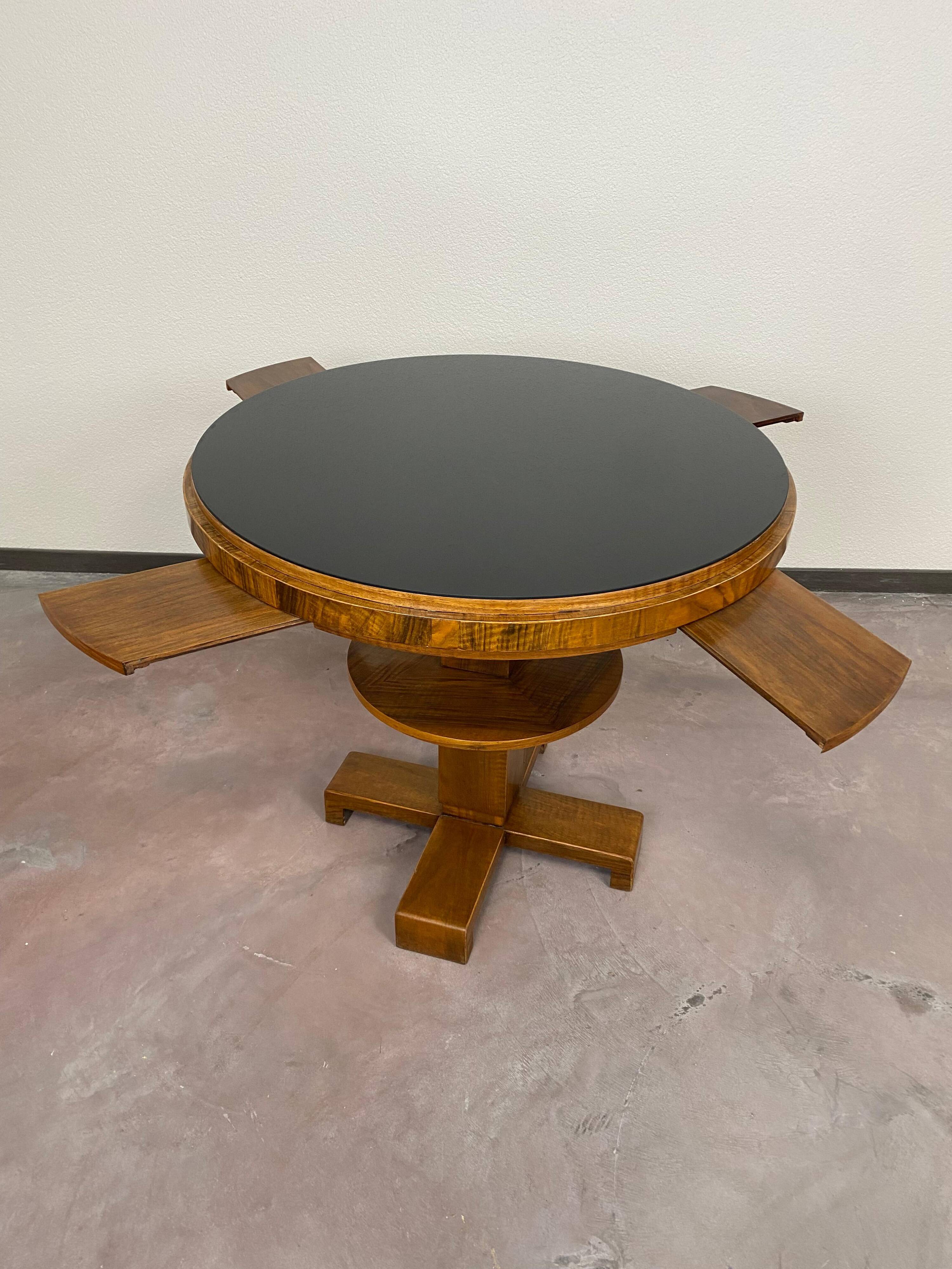 Art Deco game table with a black glass top.