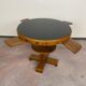 Art Deco game table with a black glass top.