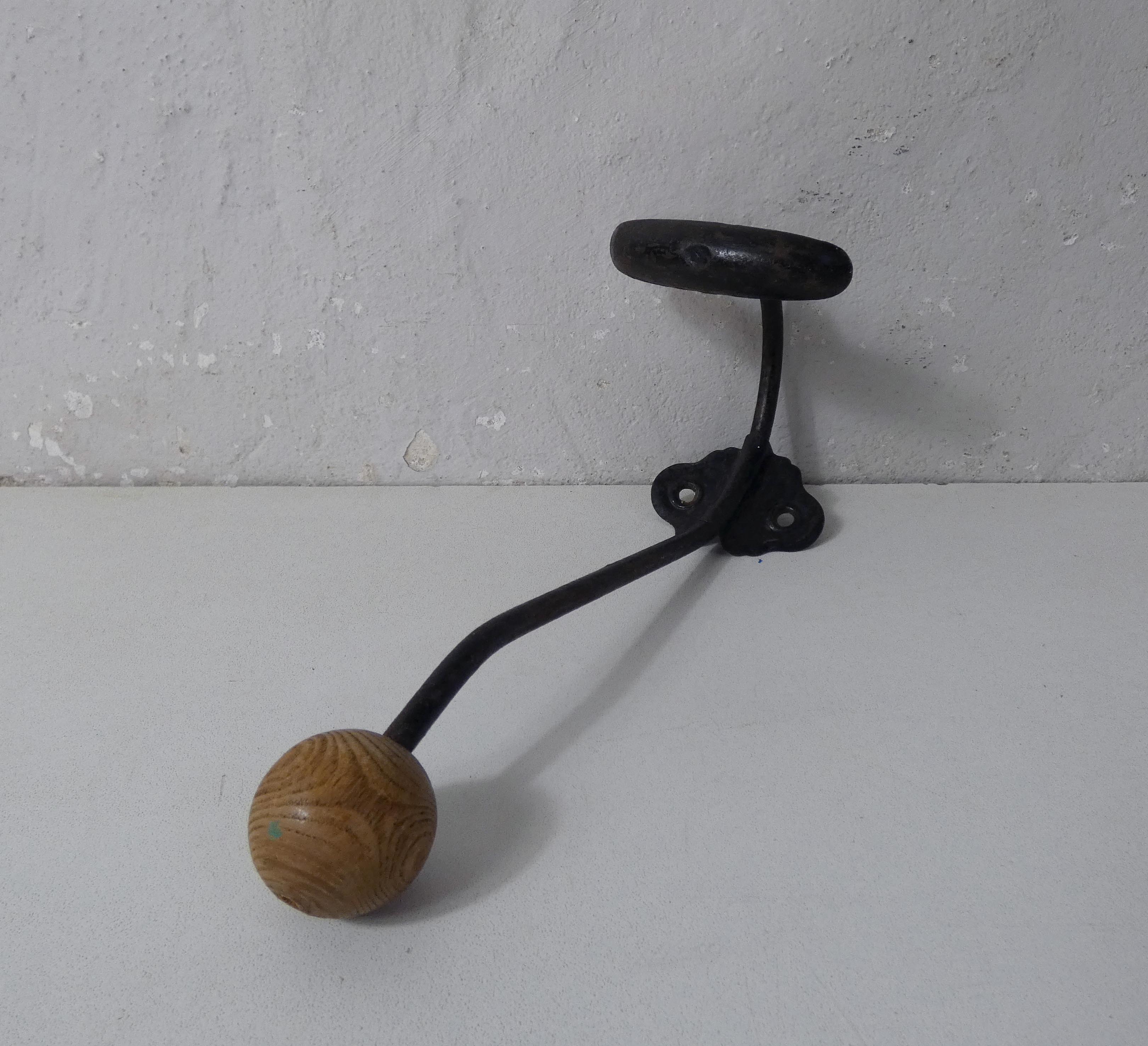 Old metal hook and wooden ball