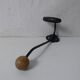 Old metal hook and wooden ball