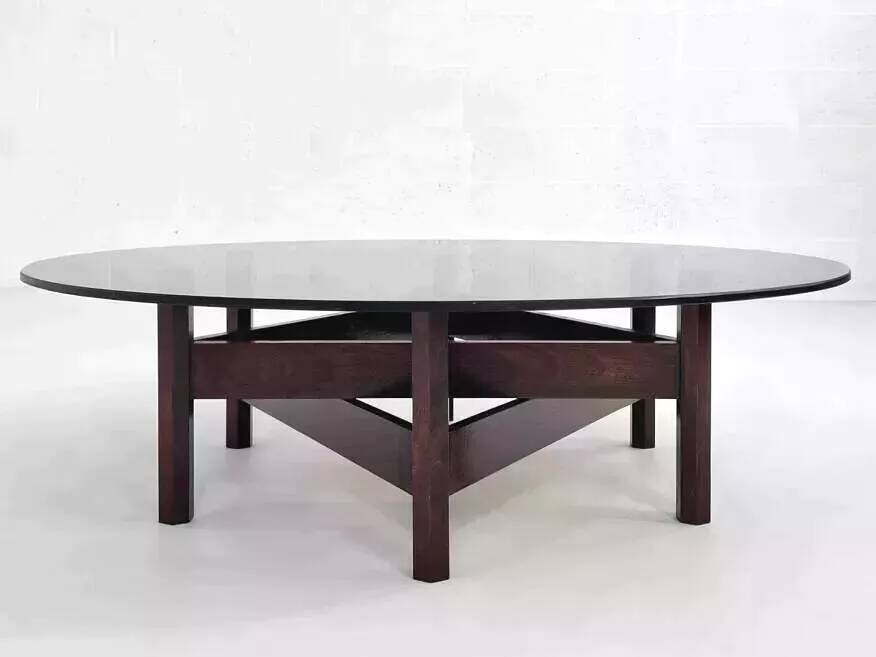 Wooden coffee table with round smoked glass top