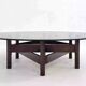Wooden coffee table with round smoked glass top