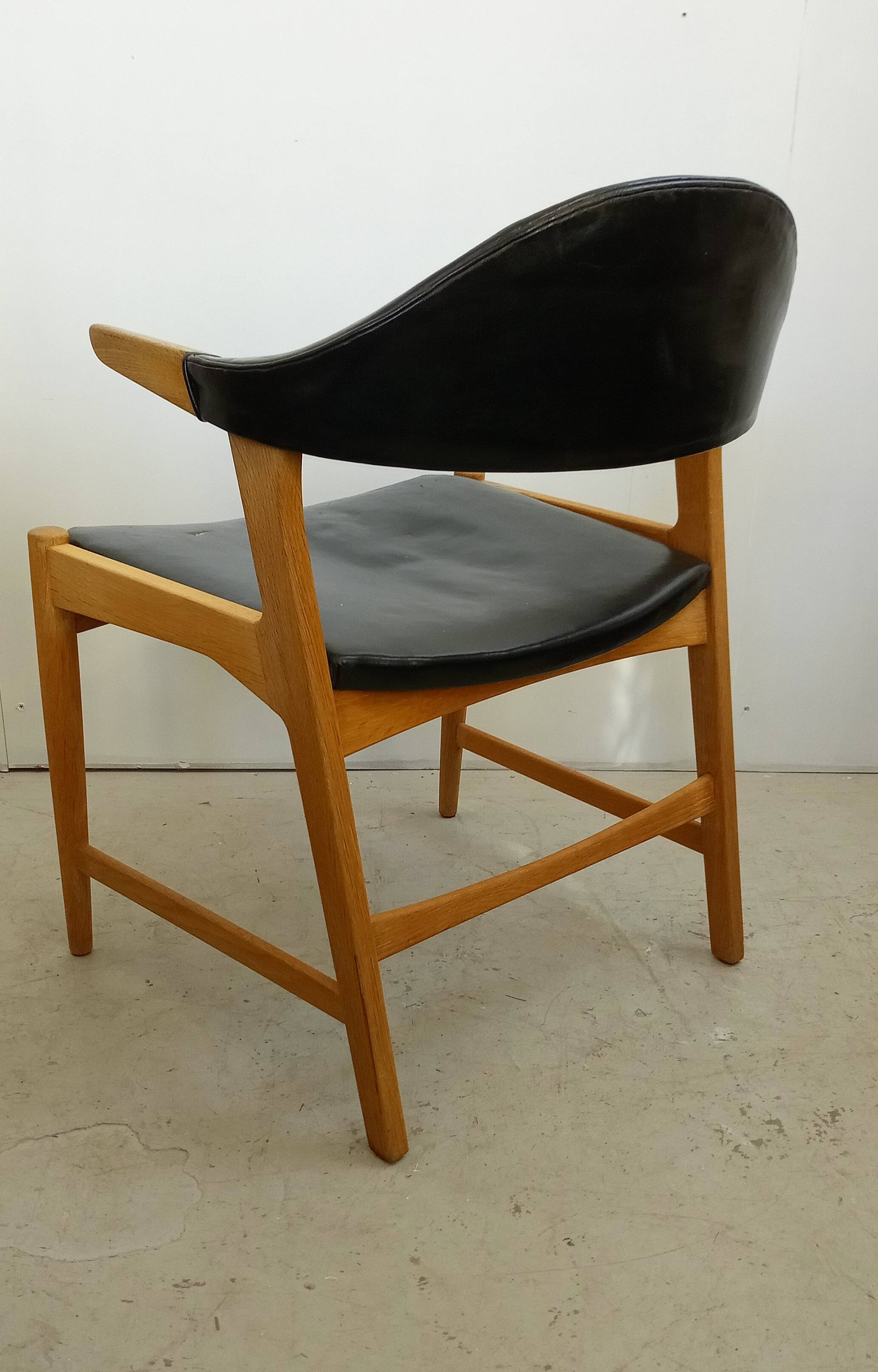 Danish armchair in oak and black leather