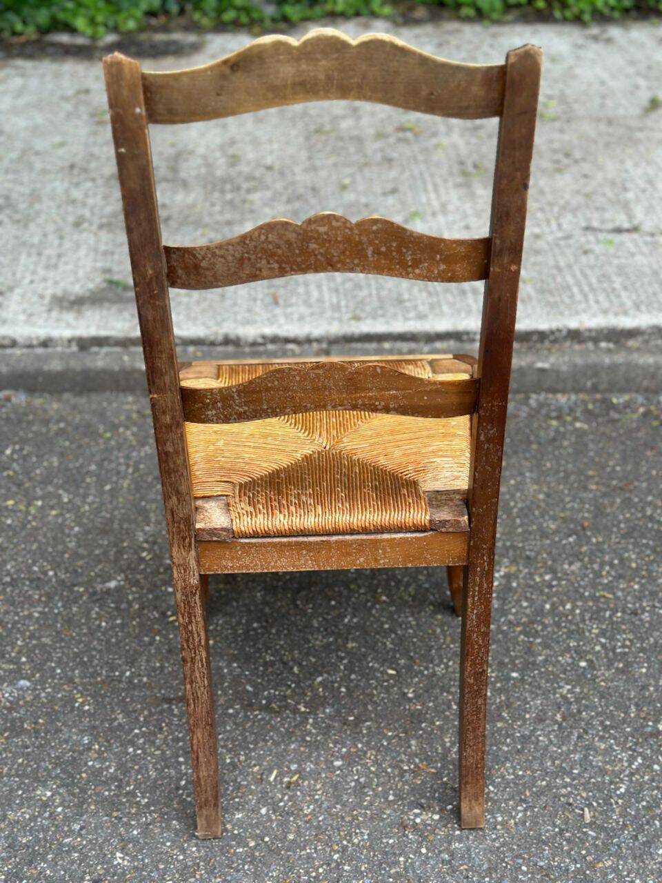 French provincial style chair in solid wood with rush seating.