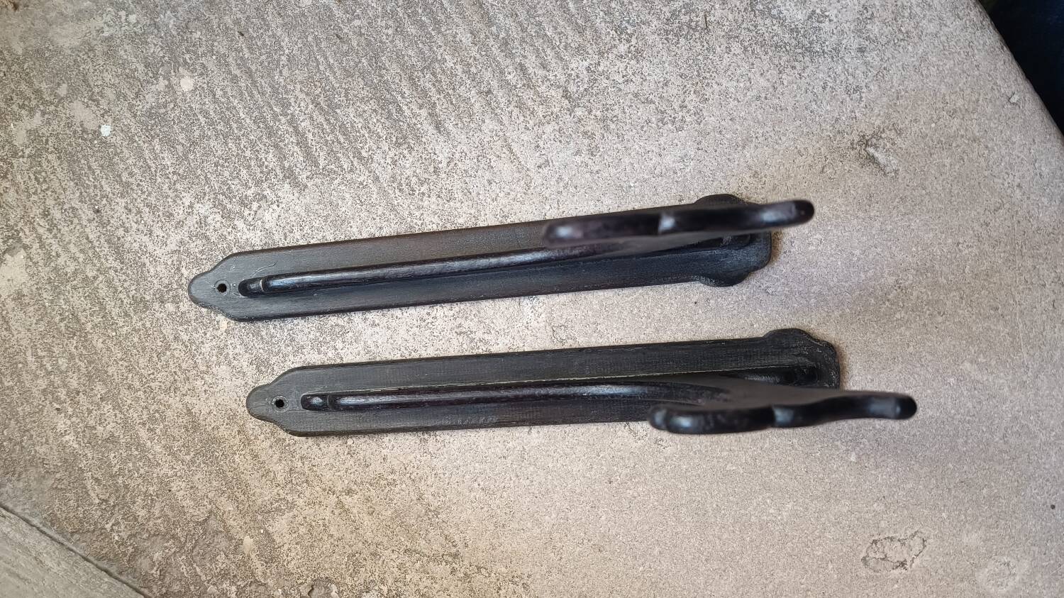 Old coat rack in blackened wood