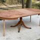 Extendable round dining table with central leg renovated in raw wood 205cm