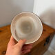 Large hand-blown glass vase in brown and beige.