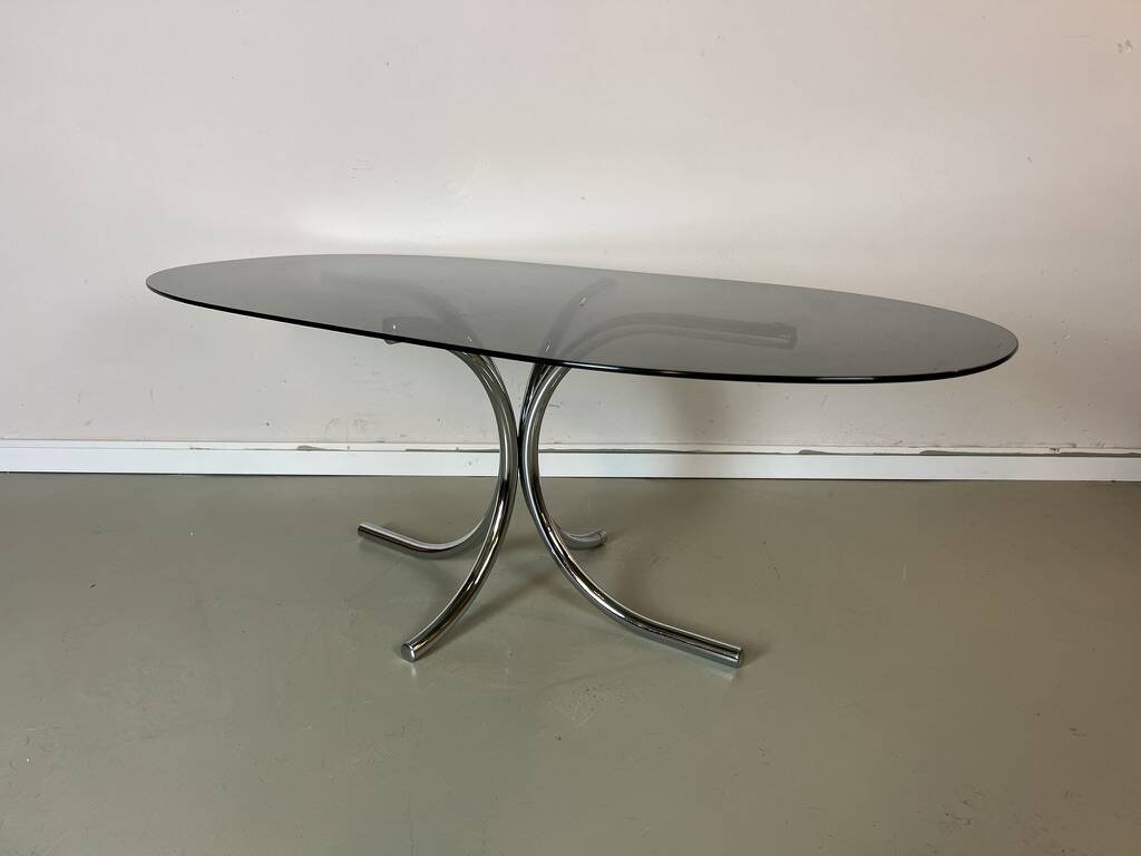 Vintage coffee table from the 70s in smoked glass and chrome, oval, Space Age style.