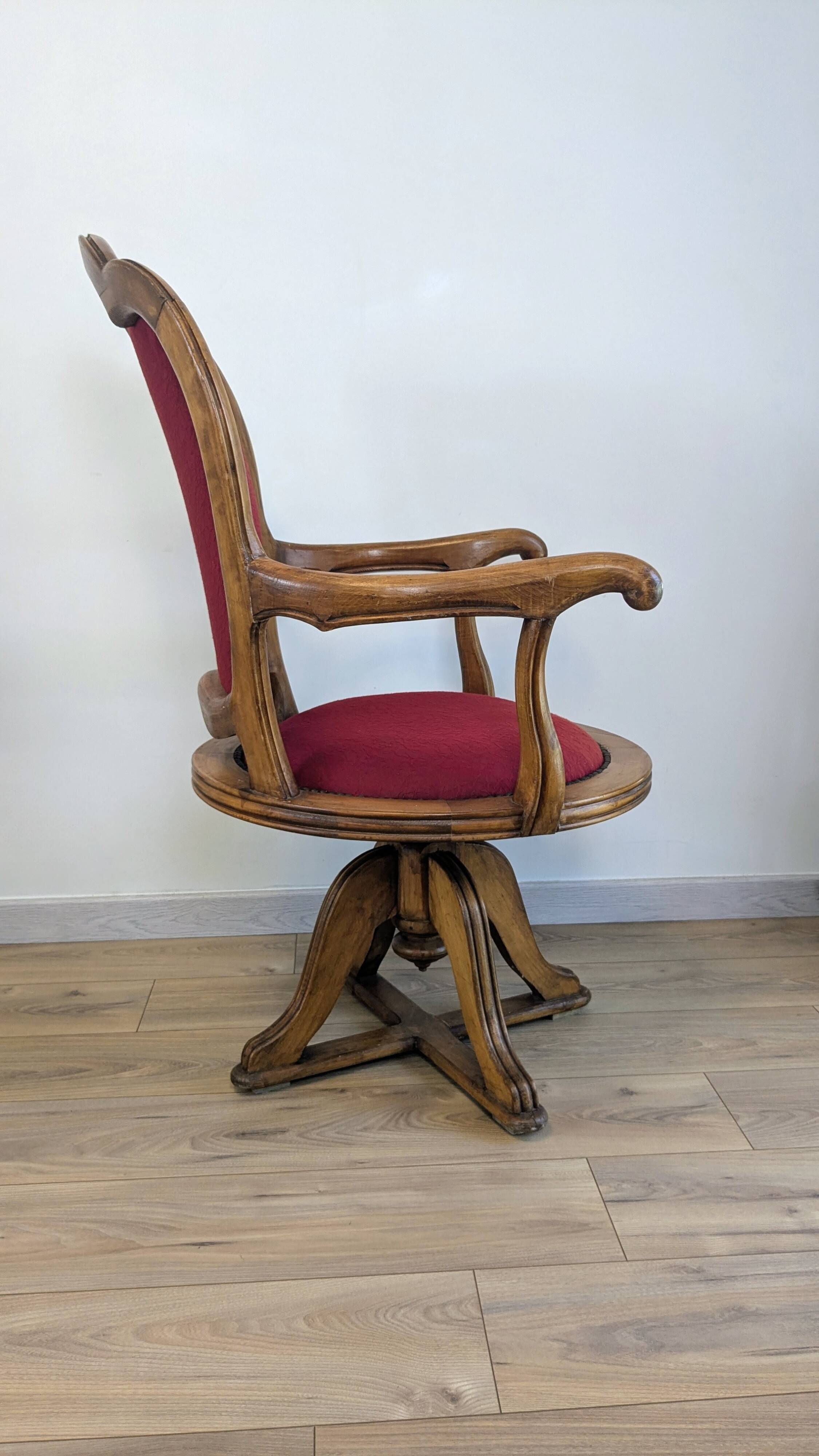 Vintage captain's chair in wood and garnet fabric — a seat with character