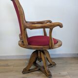 Vintage captain's chair in wood and garnet fabric — a seat with character