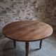 French antique round dining table in walnut, circa 1880–1900.