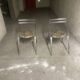 Pair of folding chairs from the 80s with leopard print seats.