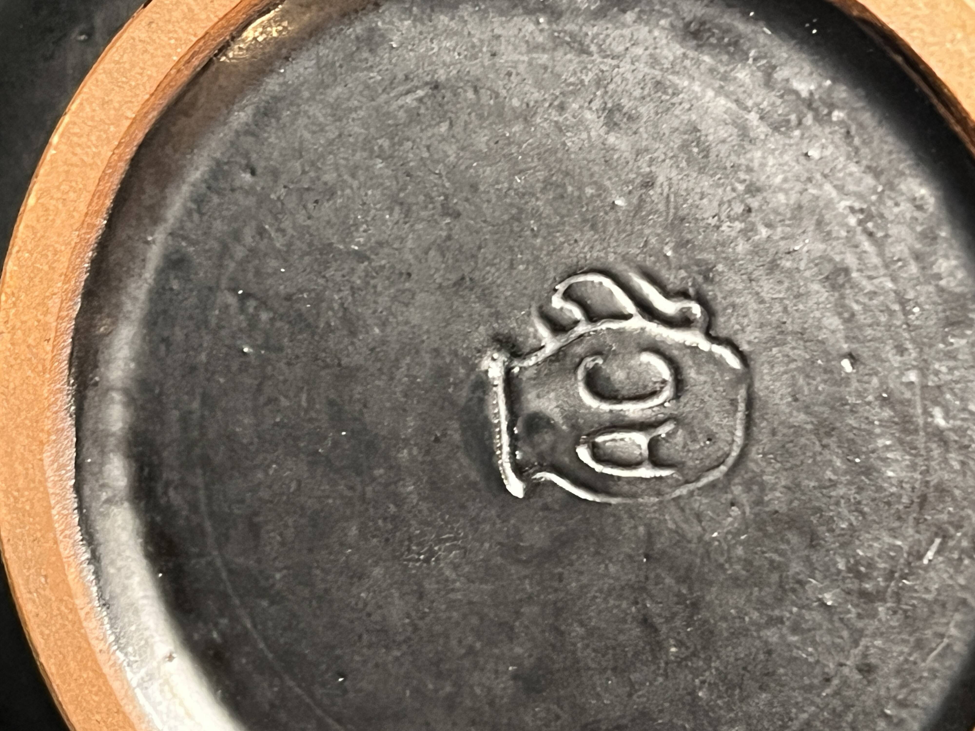 Vintage, two flamed stoneware bowls from the 20th century.
