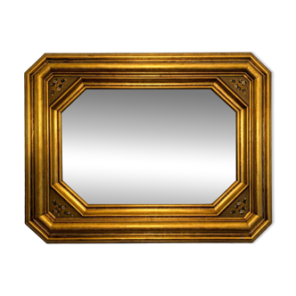 Antique octagonal mirror in gilded wood with painted floral decoration.