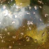 A vintage 70s blown glass pendant light with gold glitter in a globe shape