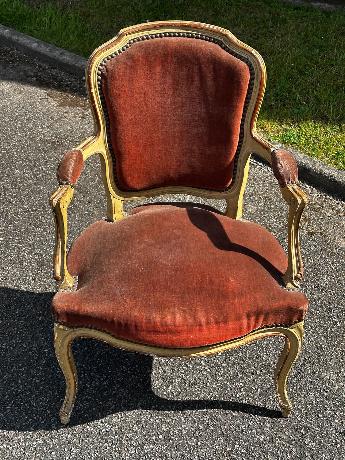 Louis XV cabriolet armchair, patinated wood and antique velvet.