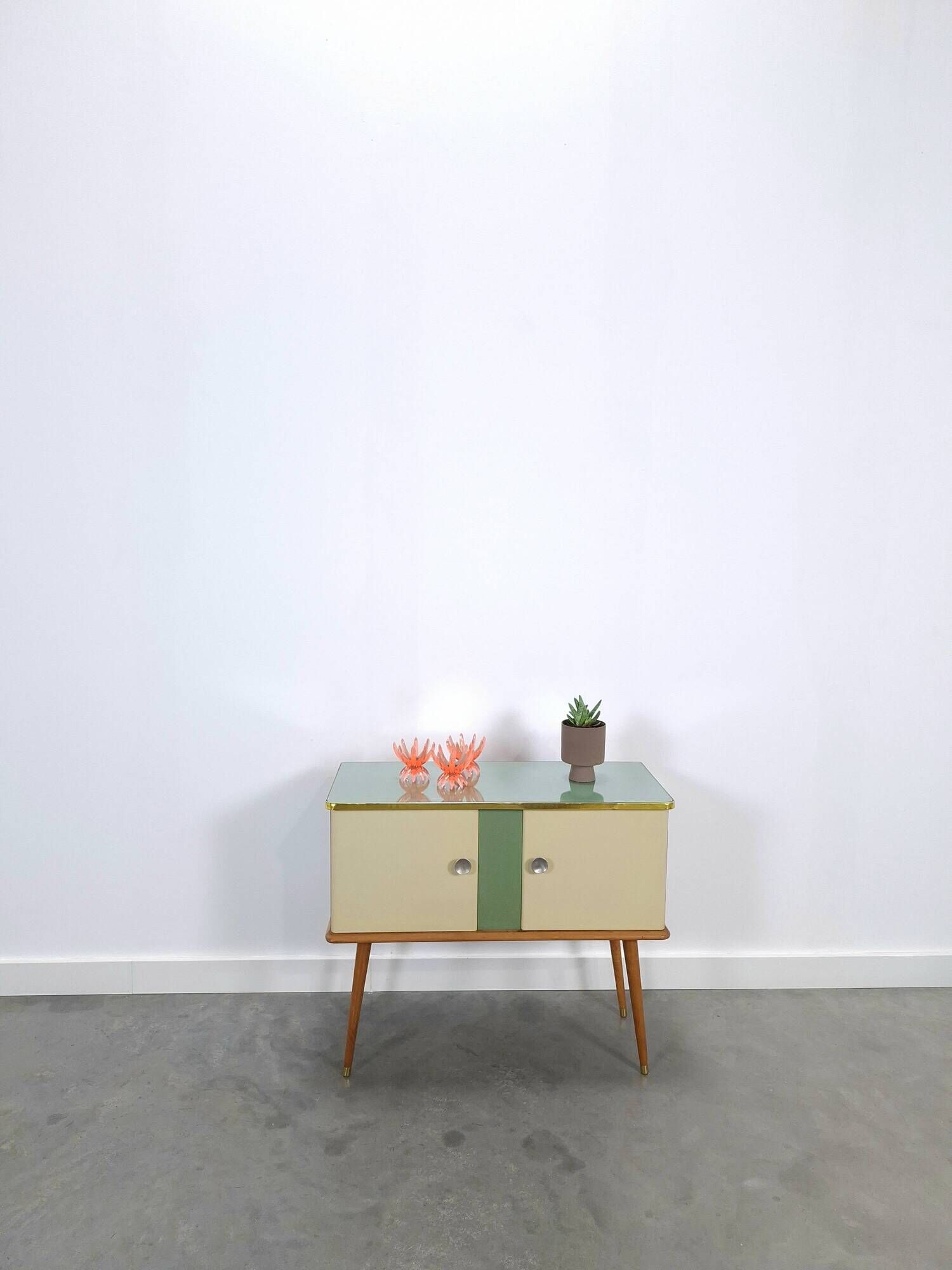 Vintage green DDR cabinet, model Libelle with glass top, slanted legs.